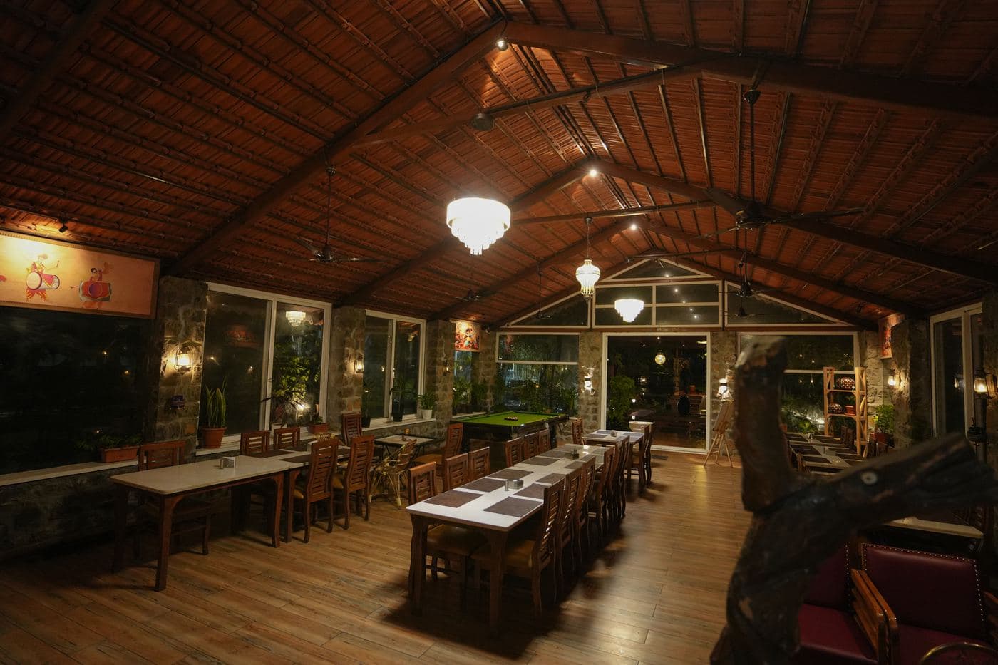 Long dining hall beneath the timber roof