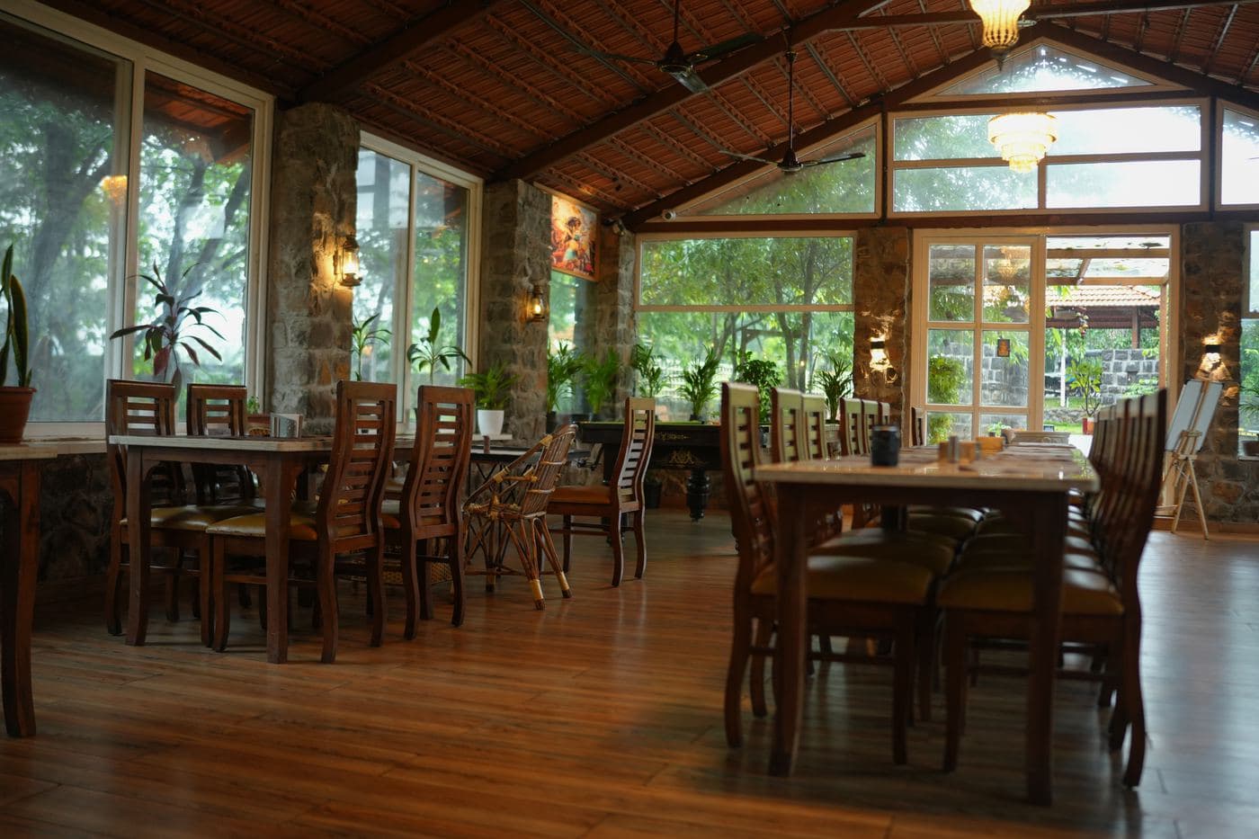 Bright dining room among the trees