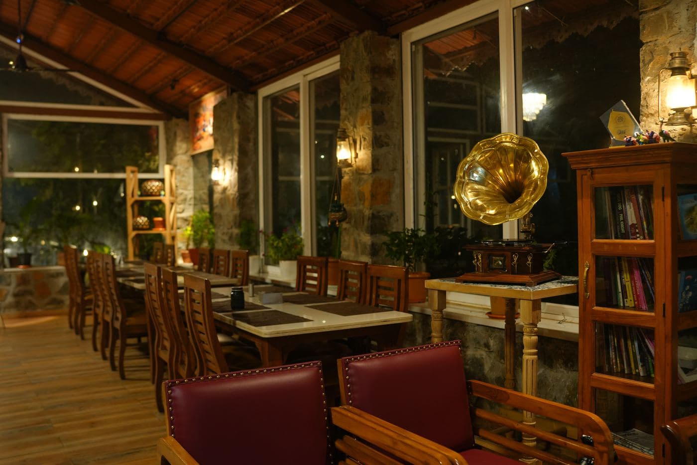 Banquette seating beside the restaurant bookshelves