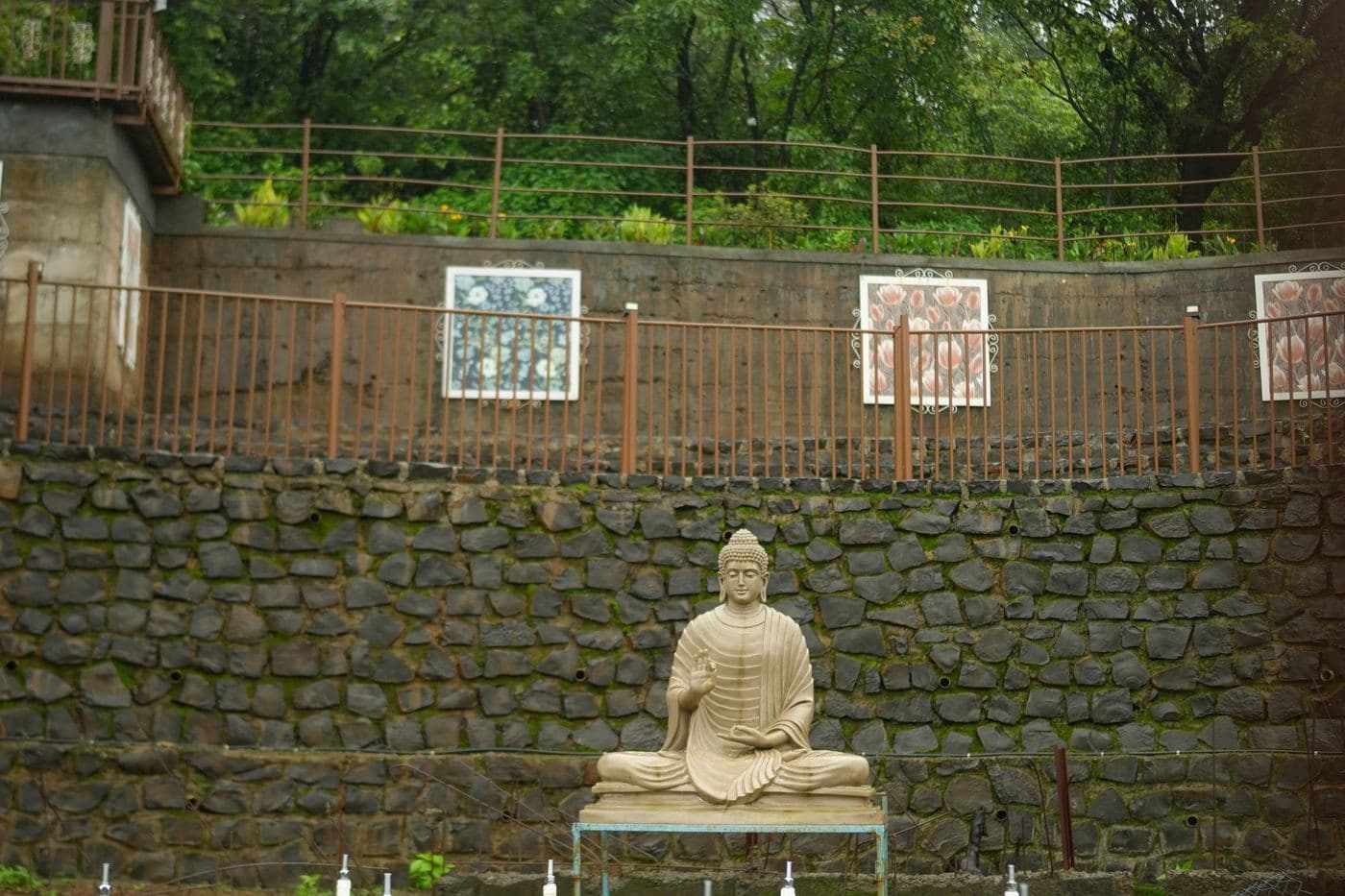 Buddha garden against the stone wall