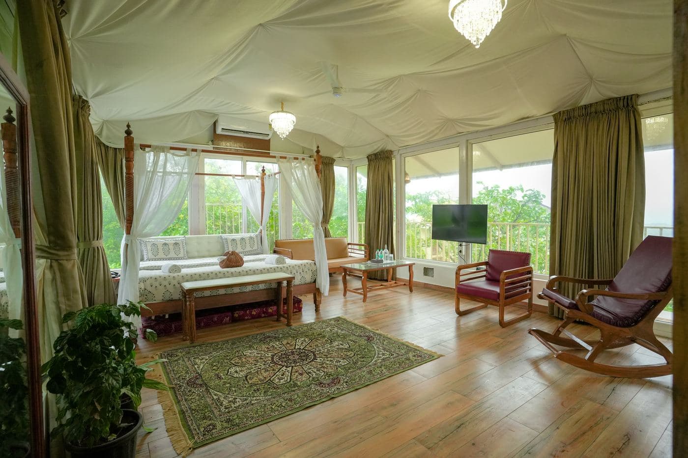 Girikunj Deluxe Room wrapped in floor-to-ceiling glass