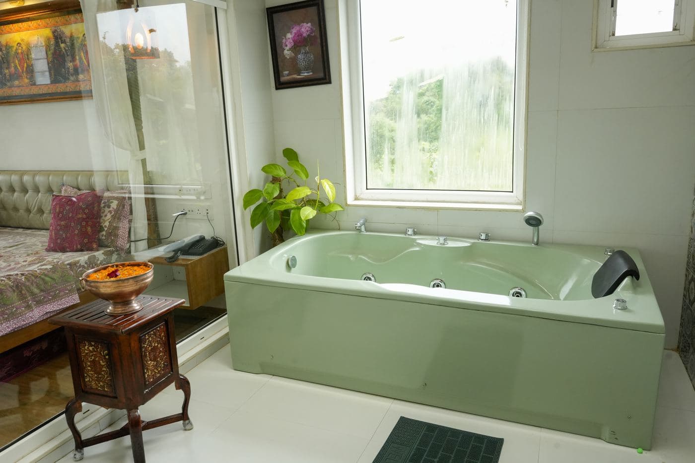 Private jacuzzi bathtub with a valley-facing window