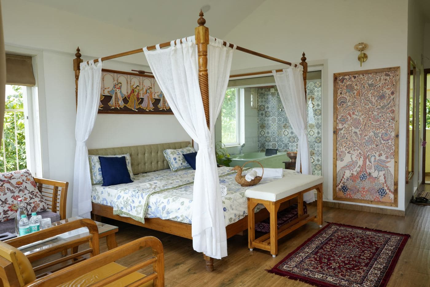 Canopy bed in a luxury room at Eshi Resorts